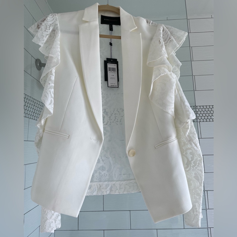 BCBG MaxAzria off white lace top with skirt. NWT with slight stain near collar.